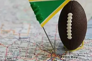 Football and Flag on map of Green Bay, WI