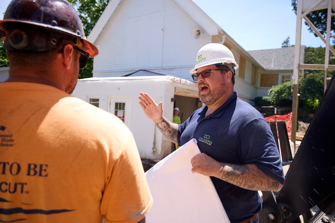 General contractor and a woman planning the commercial project