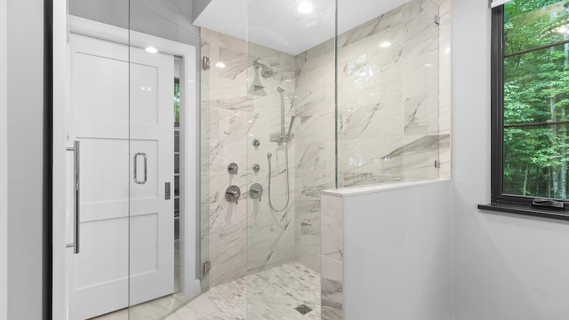 black and wooden bathroom with shower cabin