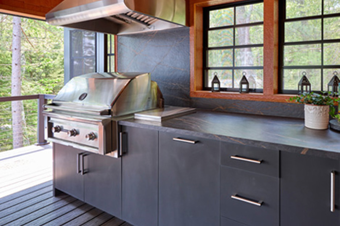 Outdoor kitchen with cabinet