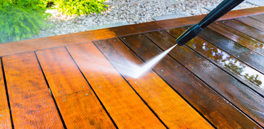 Power wash and reseal wooden deck for summer.