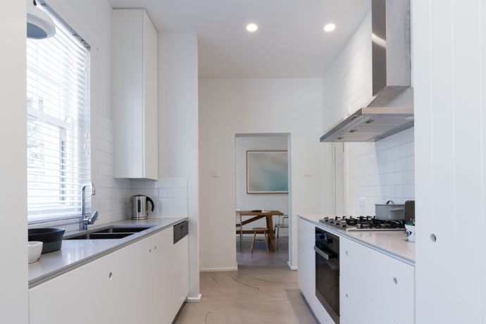 minimalistic kitchen with white cabinets