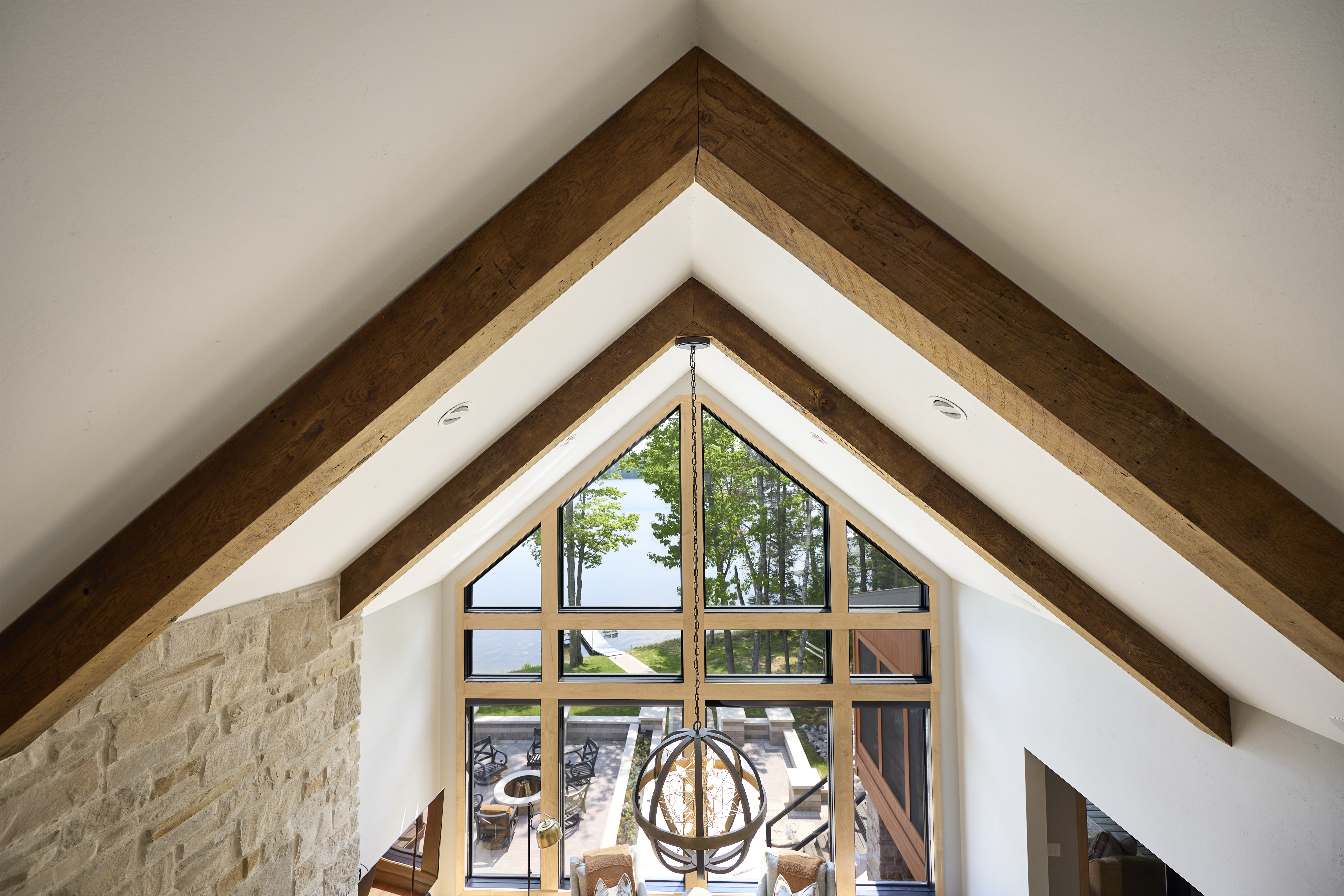 dinning room with warm wood tones and lofted ceiling 