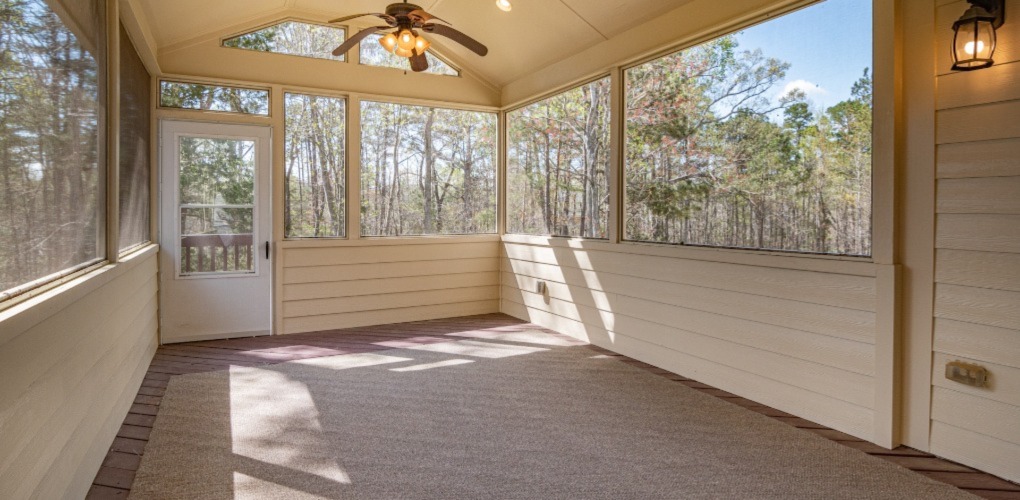 big empty house with big windows in the sunny weather