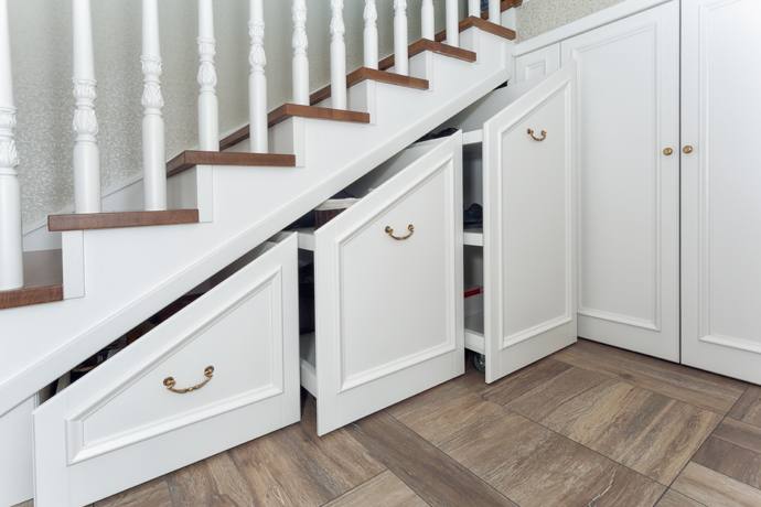 Staircase with built-in bookshelves or storage.