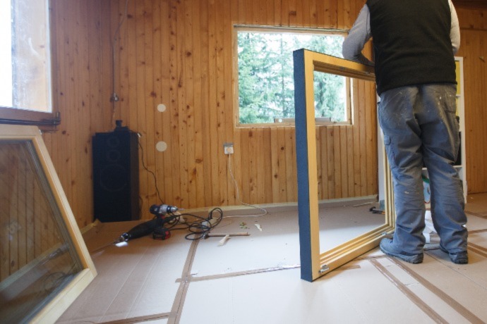 a worker installing energy efficient windows