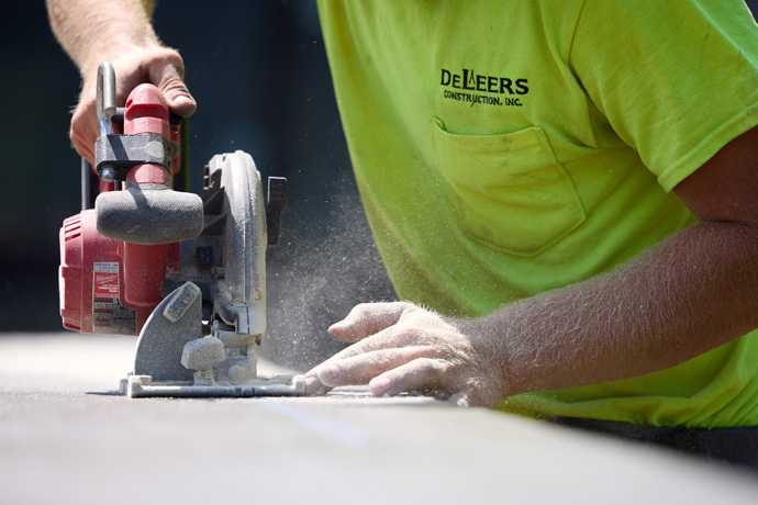 Worker using circular saw