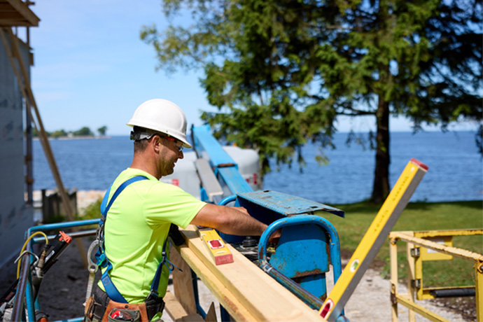Laborer working with wood