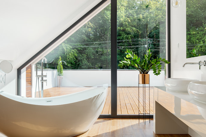 spa-like bathroom with big bath tub and big window