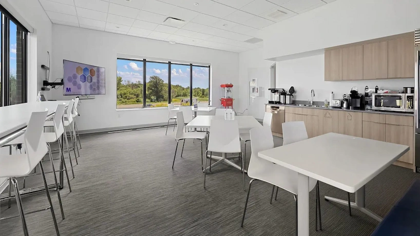 newly renovated office break room with new carpet and cabinetry