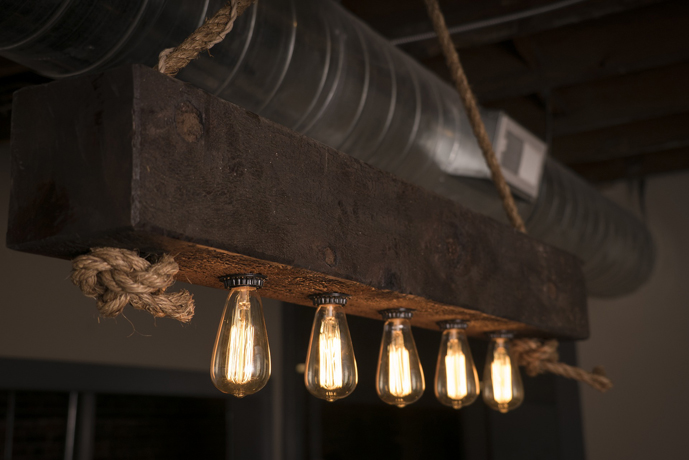 Rustic track lighting with Edison light bulbs.