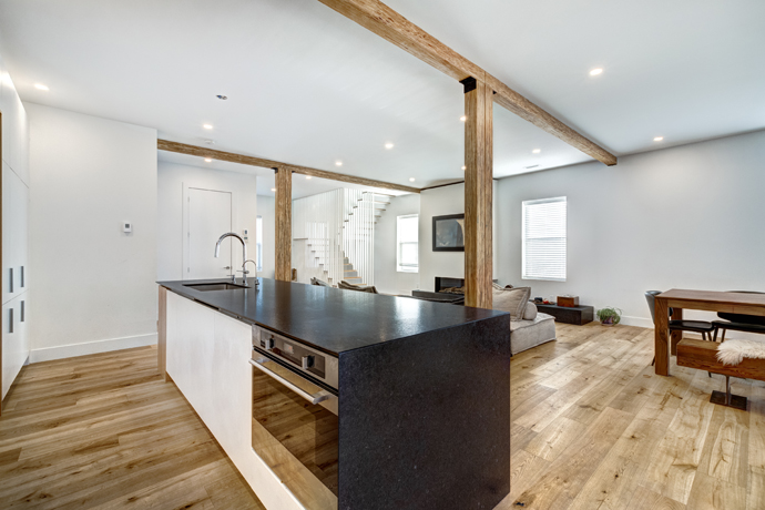 Contemporary kitchen in a luxurious finished basement.