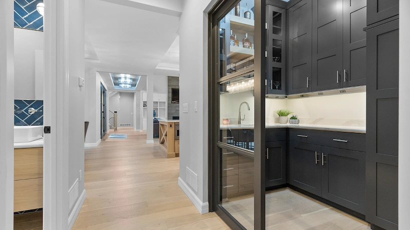 newly built galley kitchen with black cabinetry