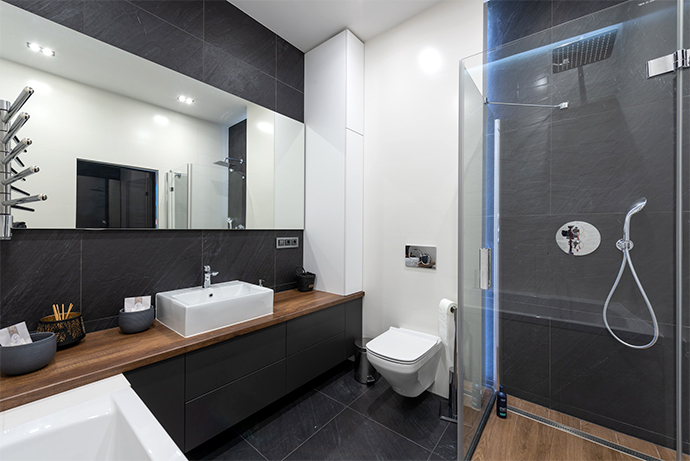 black and wooden bathroom with shower cabin