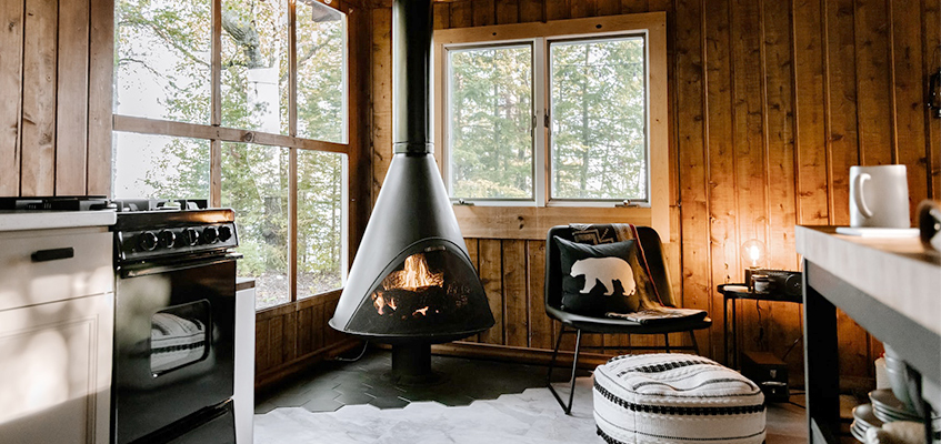 dinning room with a fireplace in a wooden house