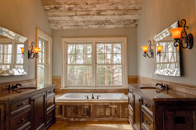 Bathroom style design using natural materials with warm lighting fixtures.