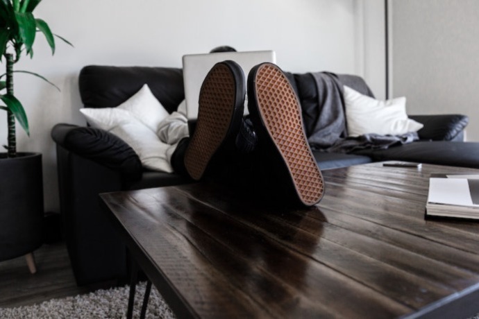 a person laying on the couch stress free