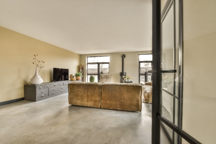 a living room with leather flooring