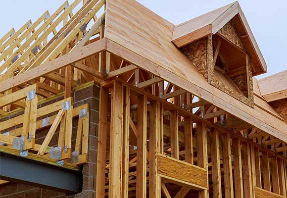 Framing work of a roof and walls.