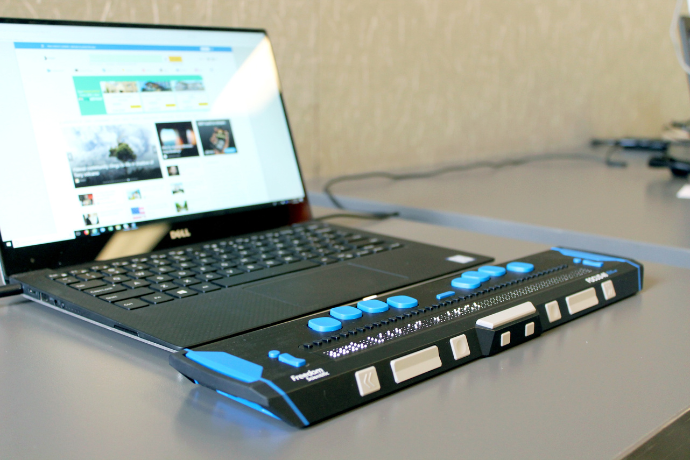 braille keyboard by the laptop