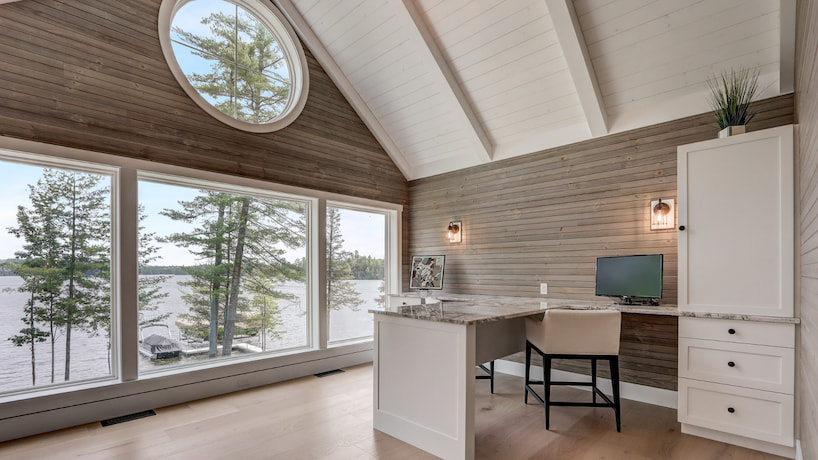 luxury office space in the attic of the house with the view of the lake