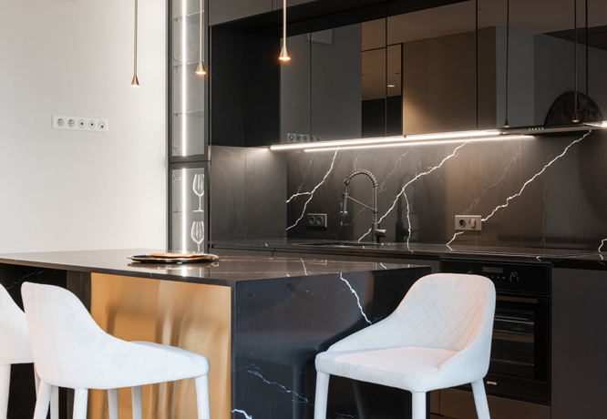 Kitchen built with black and white modern and sleek style.