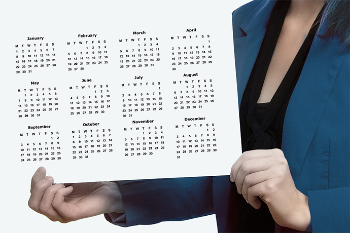 a woman holding a calendar