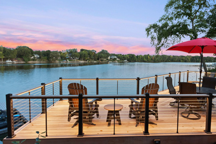 Deck with a view of the sky and river