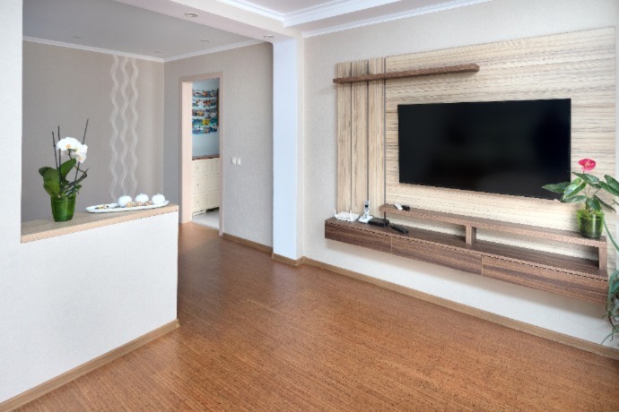 a corridor in the house with cork flooring