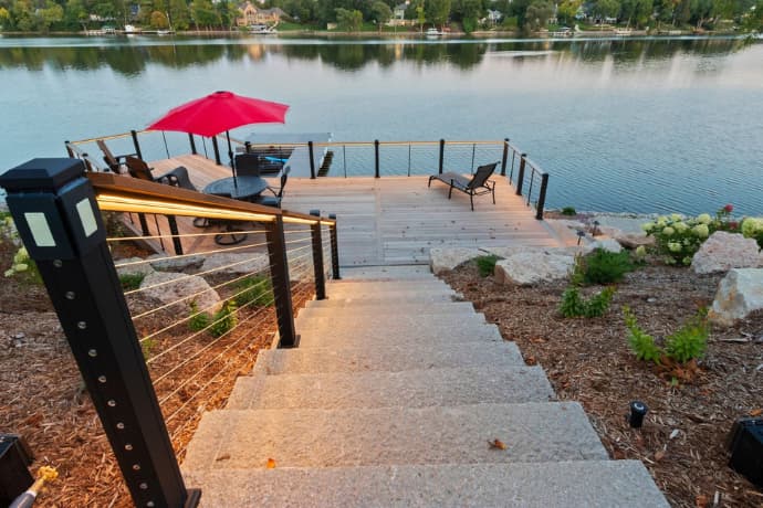 stairs from the deck leading to the lake