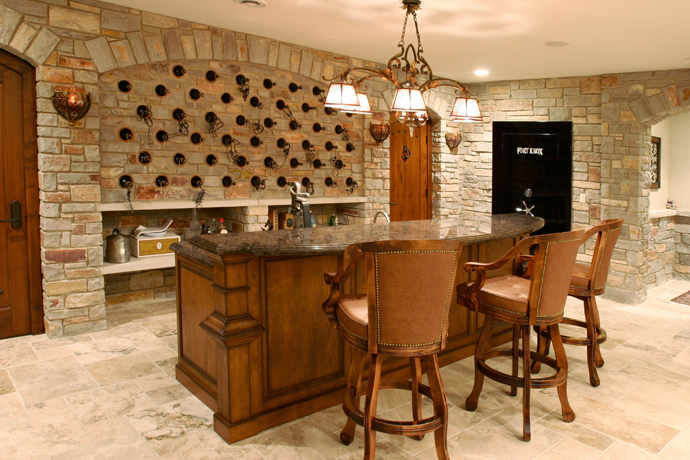 Remodeled finished basement with rustic style wet bar and wine cellar.