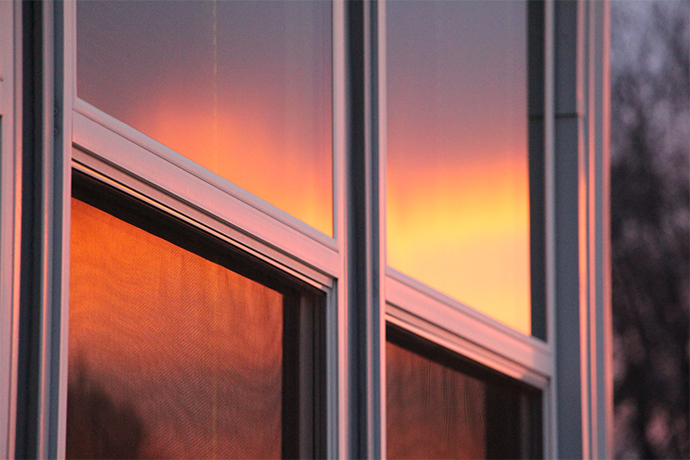 window with the reflection of the sunset