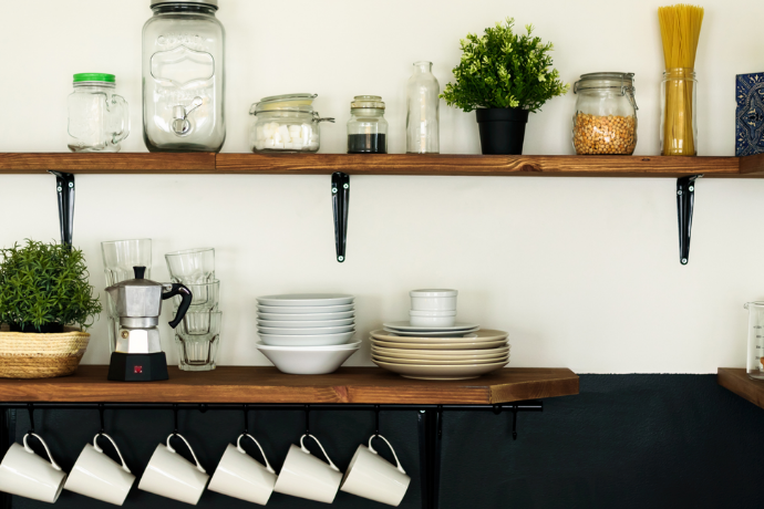 wooden shelves with plates and cups on them