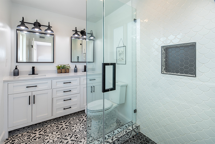 bright white bathroom with black ornament tile