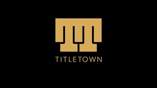 Titletown logo in gold on black background