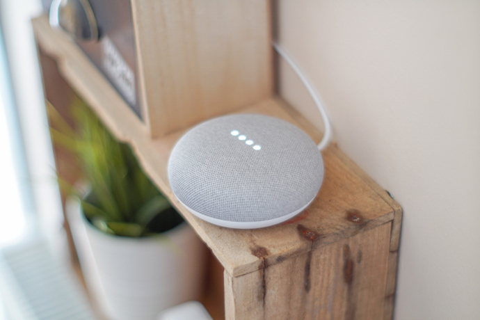 Google home smart home device on shelf.