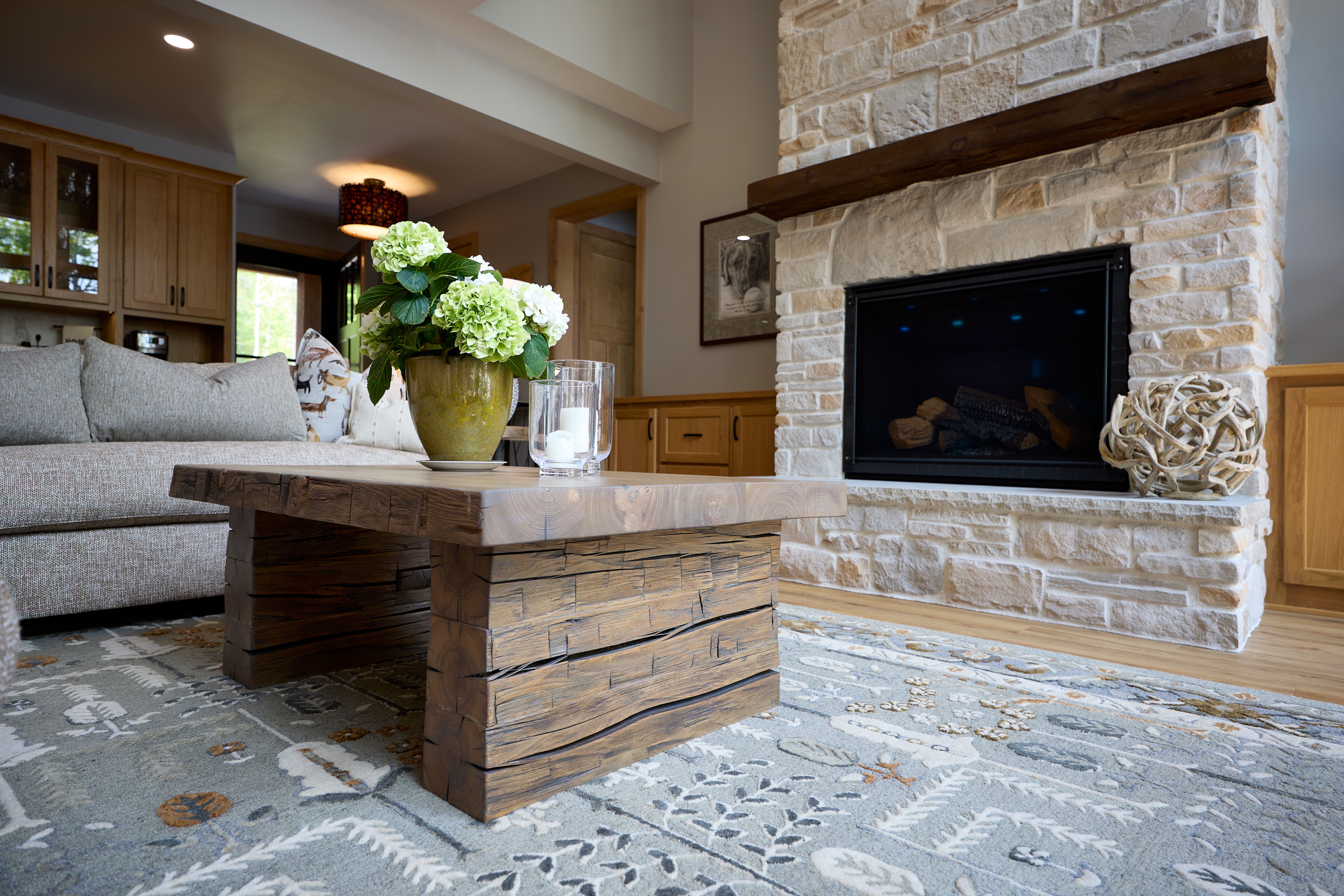 dinning room with a fireplace in a wooden house