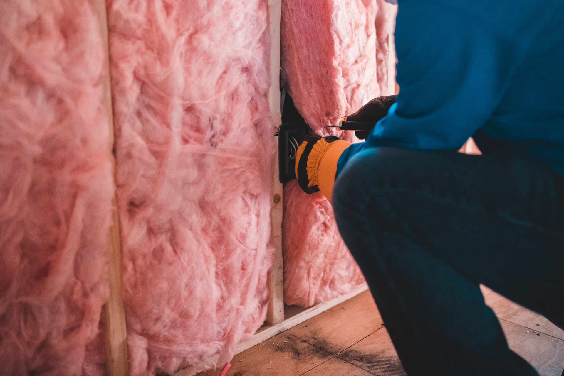 Adding insulation to walls for an efficient home.