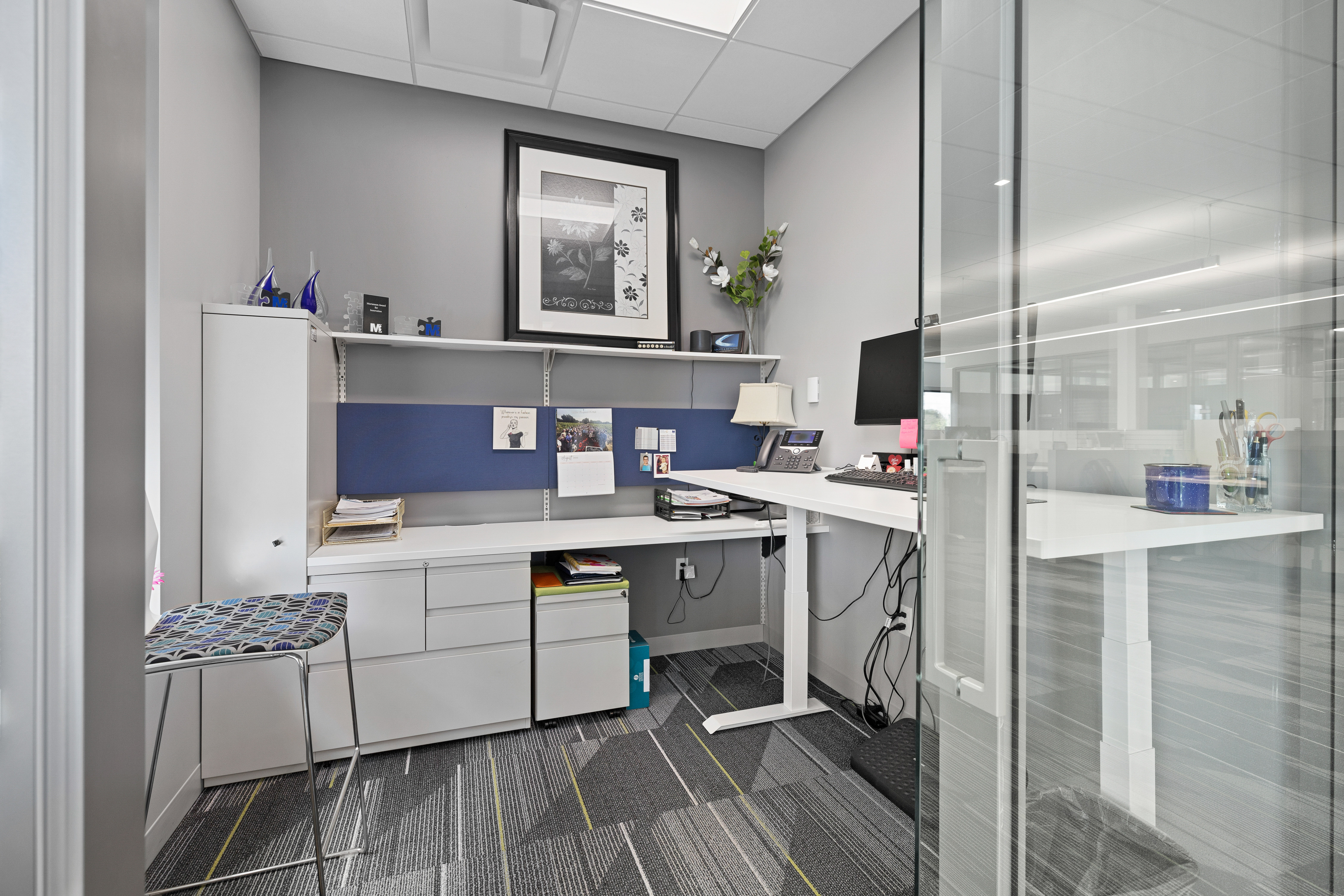 office space with images on the wall making it more personal