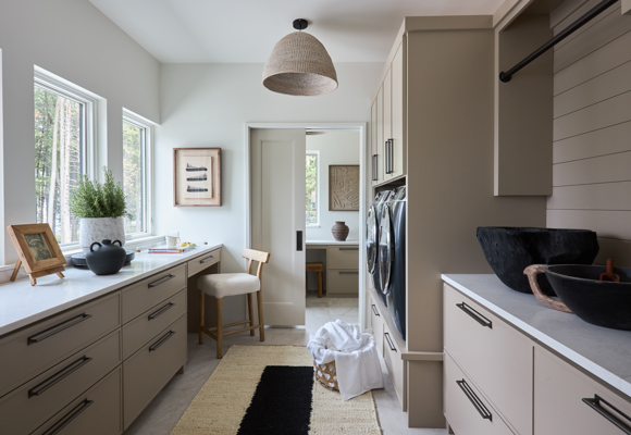 Laundry area with a work area and storage