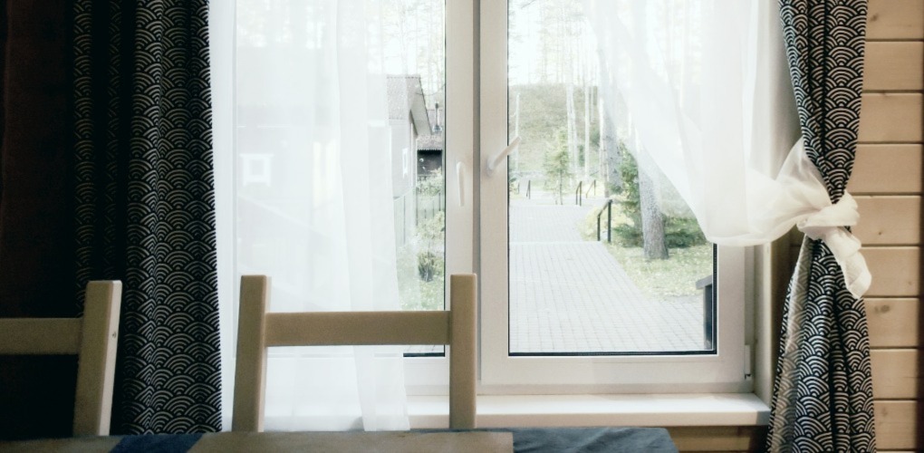 a window with green drapes 