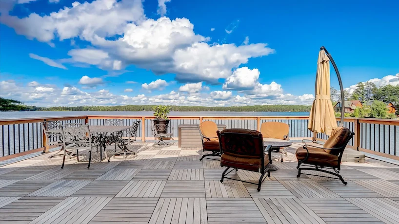  New angle of newly renovated deck over a creek and surrounded by pine trees