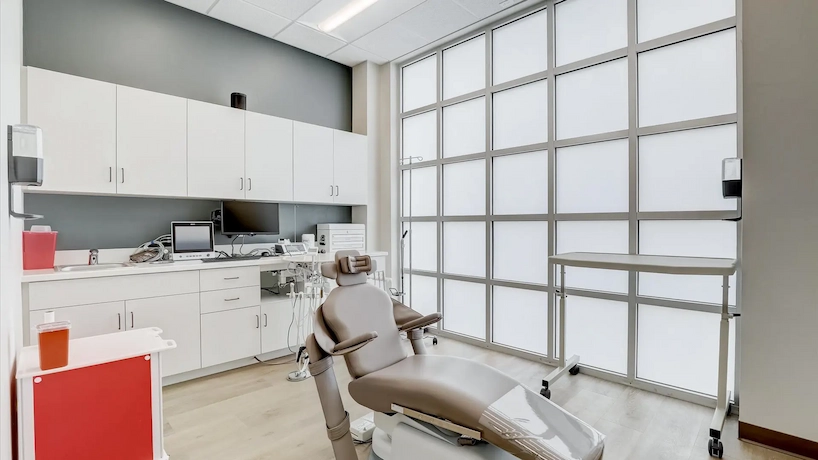 dental office room with new white cabinetry and oak flooring