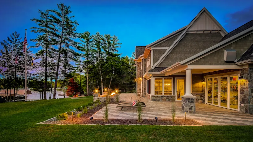 Backyard of newly built luxury home sitting on a lakeside