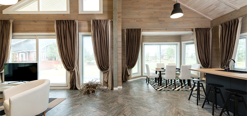 dinning room with warm wood tones and lofted ceiling 