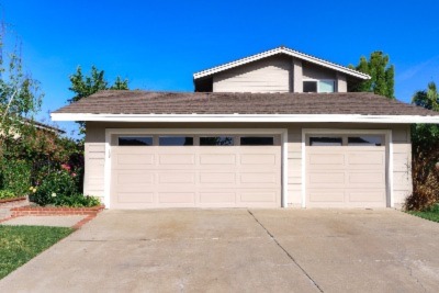 the garage of the house painted beige 