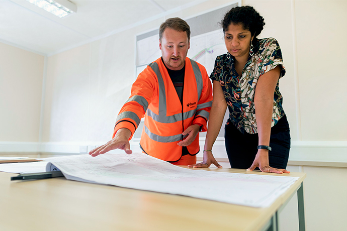 General contractor and a woman planning the commercial project