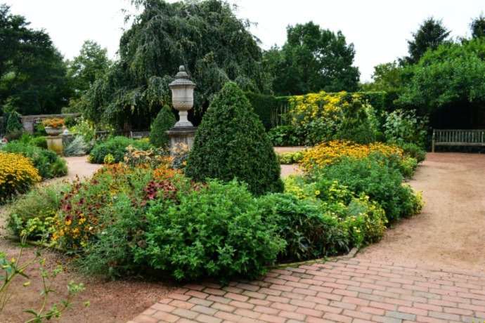backyard with lots of bushes and gardens