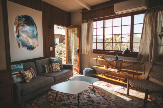 spacious living room with a big window and view of the nature