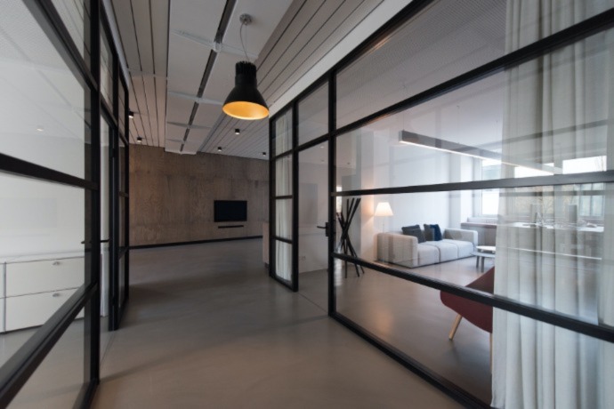 commercial space with glass doors and wooden floors